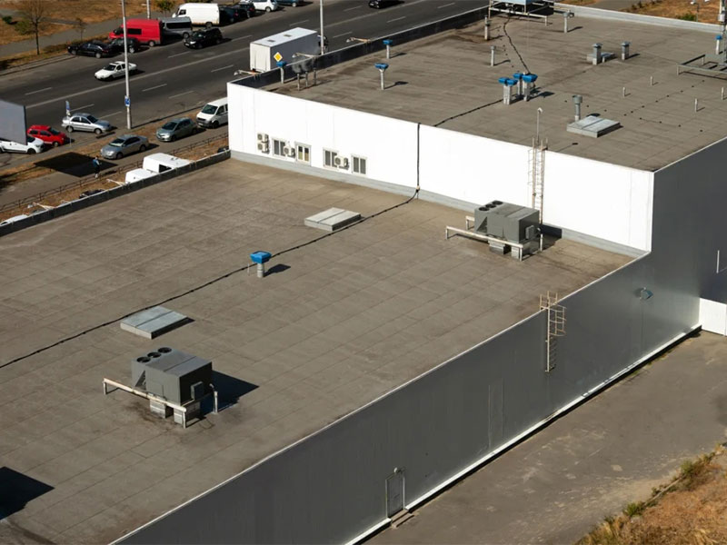 Flat commercial roof with HVAC units installed.