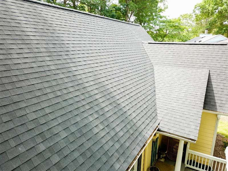 Residential house with a gray asphalt shingle roof