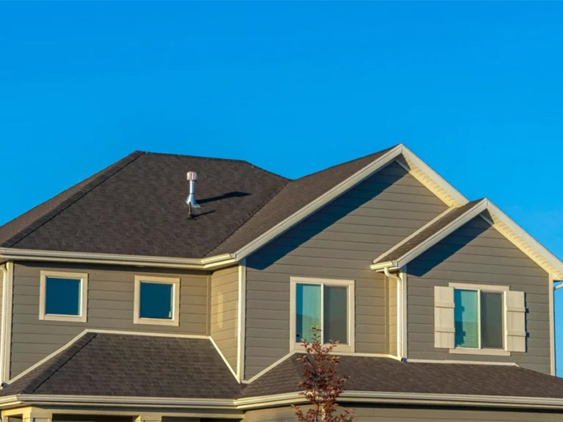 Asphalt shingle hip roof with chimney vents.