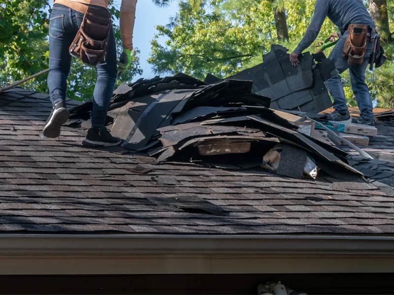 DIY roofing guide showing shingles being removed