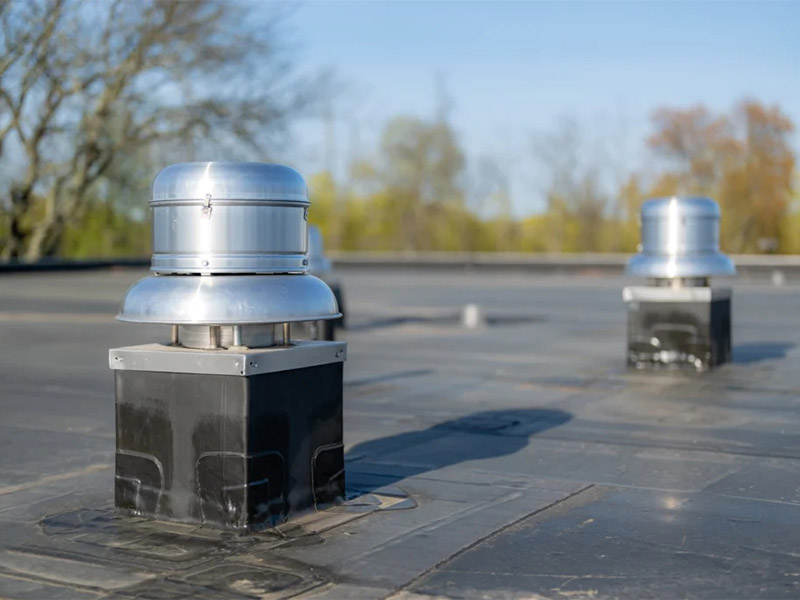 EPDM flat roof with metal exhaust vents