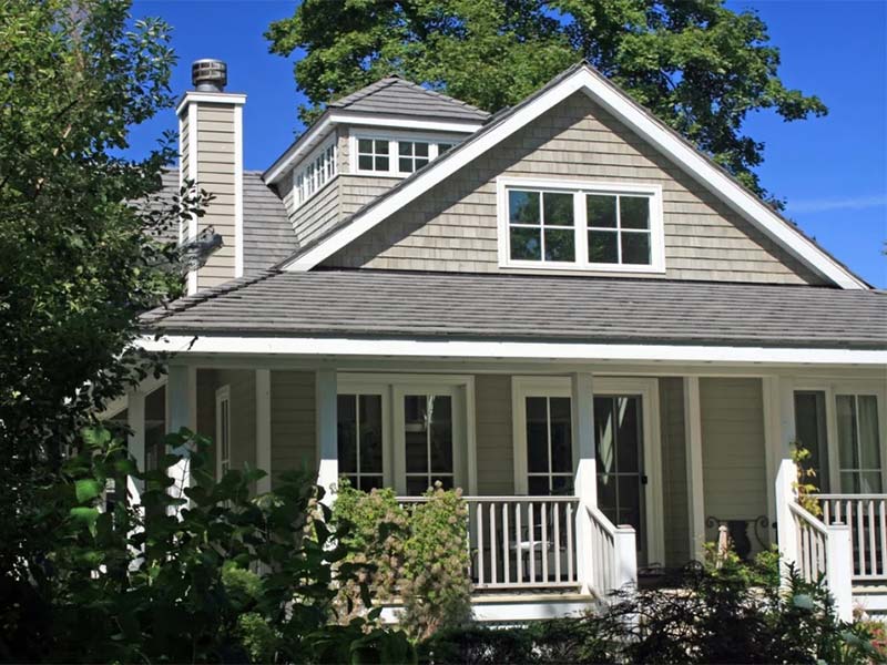 House with a gray shingle roof.