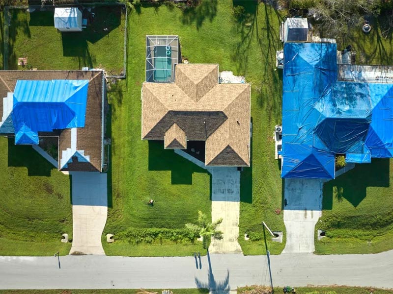 How to tarp a roof to prevent storm damage