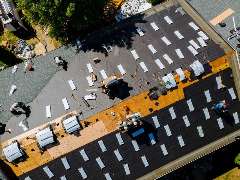 Roof installation DIY guide with workers installing shingles