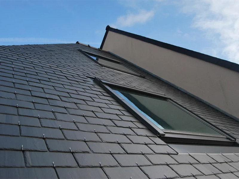 Modern house with a dark slate roof.