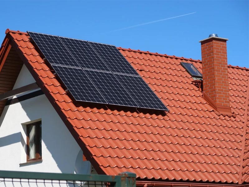 Solar panels installed on a tiled roof.