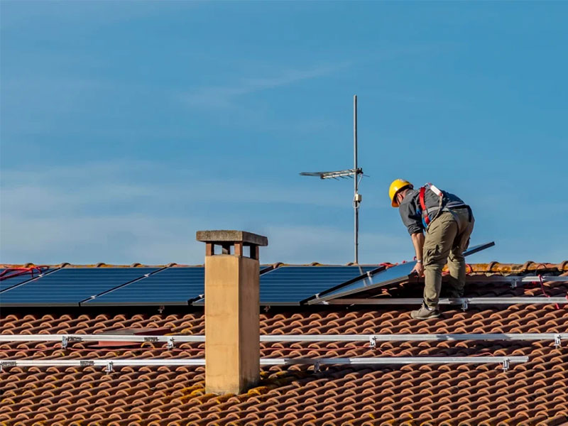 Different types of solar panels installed on rooftops.
