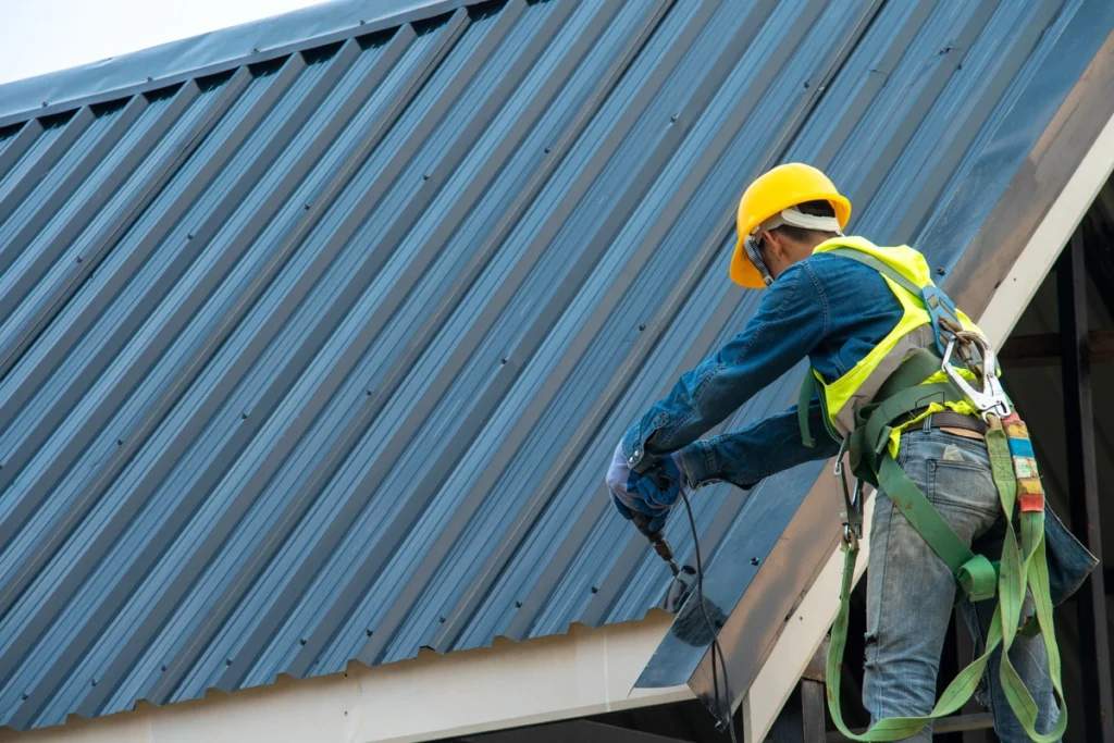 A person is working on a metal roof