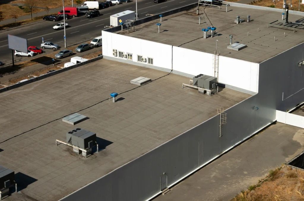 A large commercial black roof aerial view