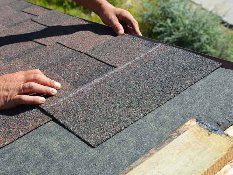 laying asphalt shingles